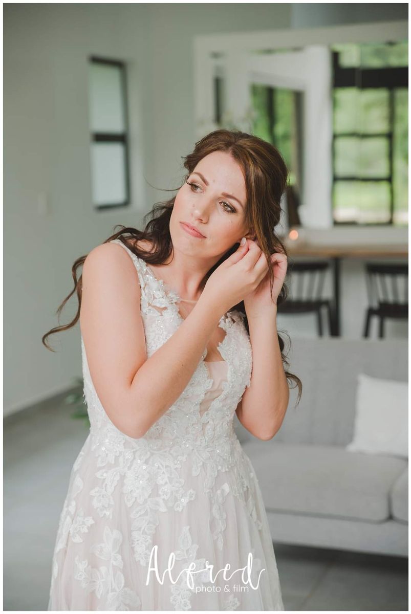 A model showcasing avant-garde eye makeup with graphic liner and vibrant colors.